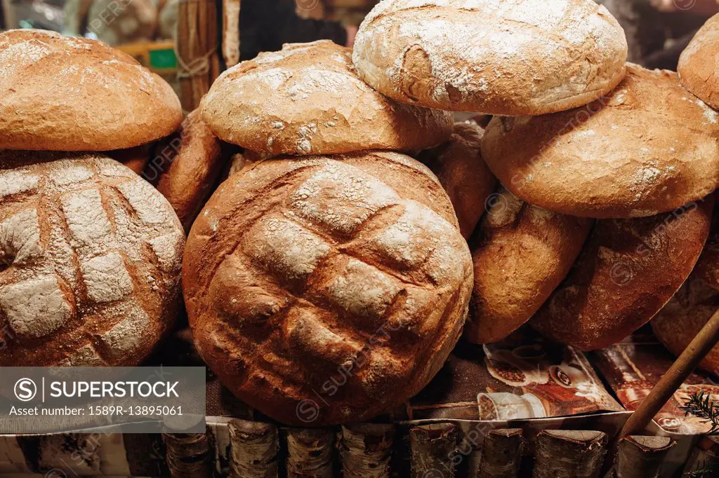 Pile of loaves of bread on table