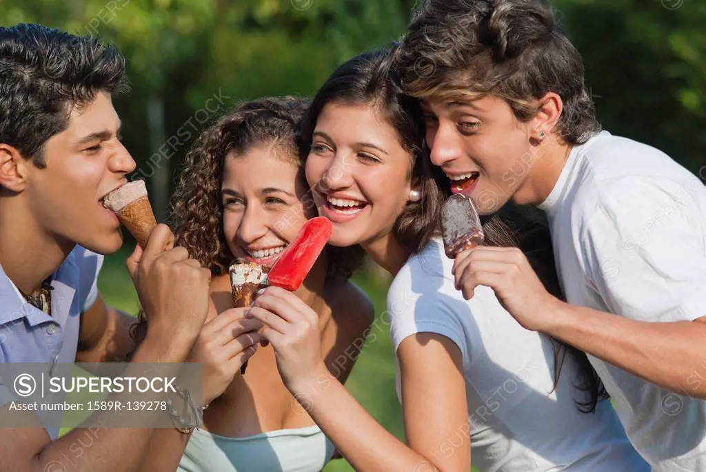Hispanic friends eating ice cream together