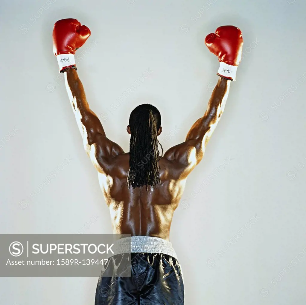 Boxer standing with hands raised