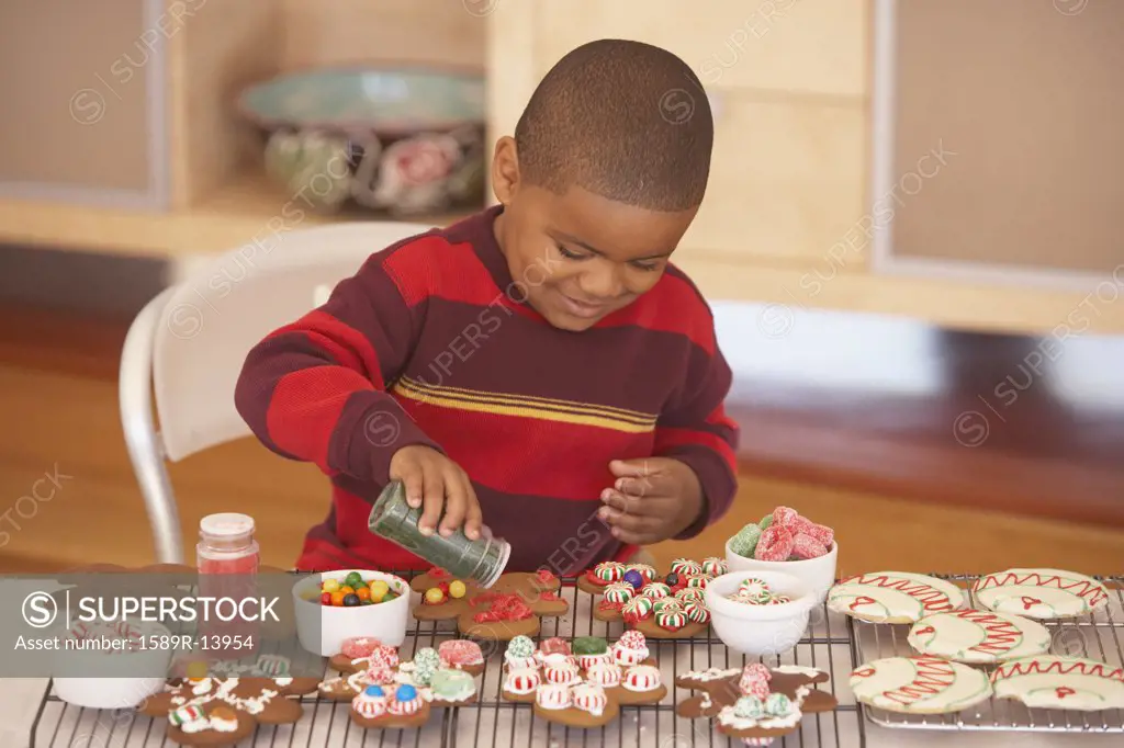 Young boy making gingerbread men
