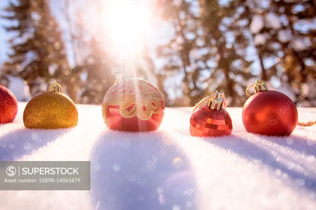Christmas ornaments in snow