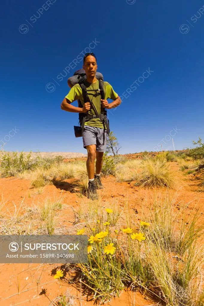 Black man hiking in desert