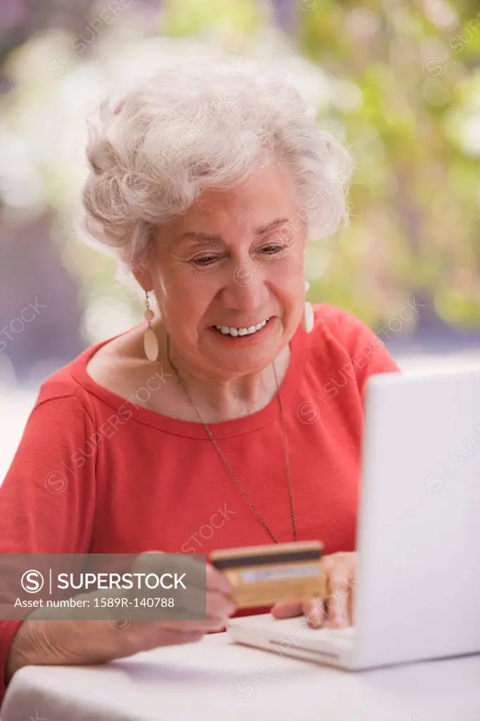Chilean woman shopping online with credit card