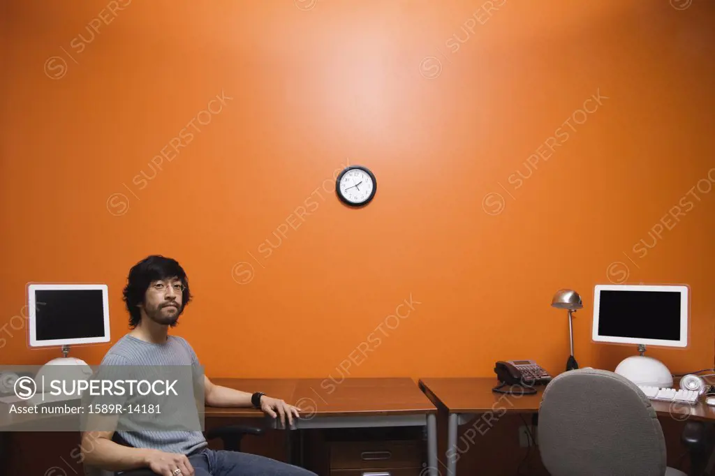 Man sitting by desk