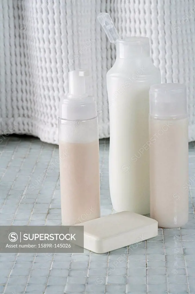 Soap and bottles shampoo, conditioner and shower gel