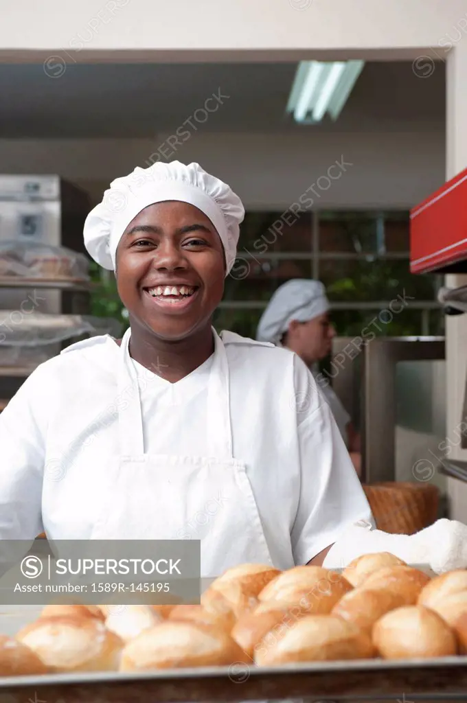 Mixed race baker working in commercial kitchen