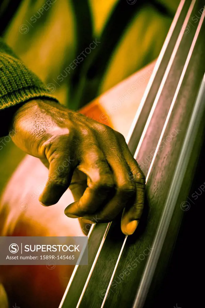 Black musician playing double bass