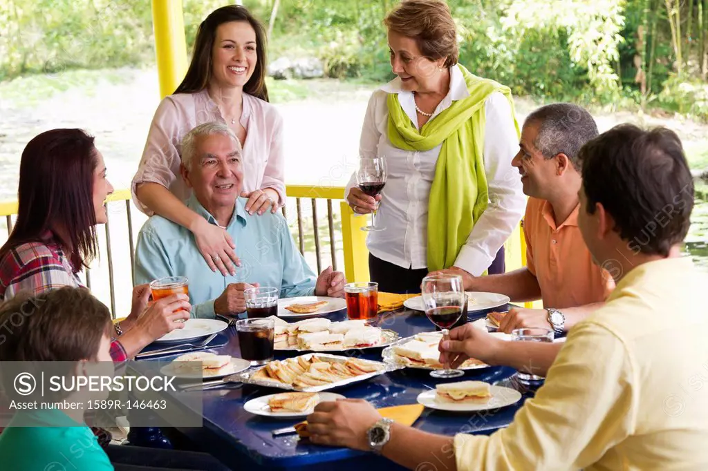 Hispanic family enjoying meal together