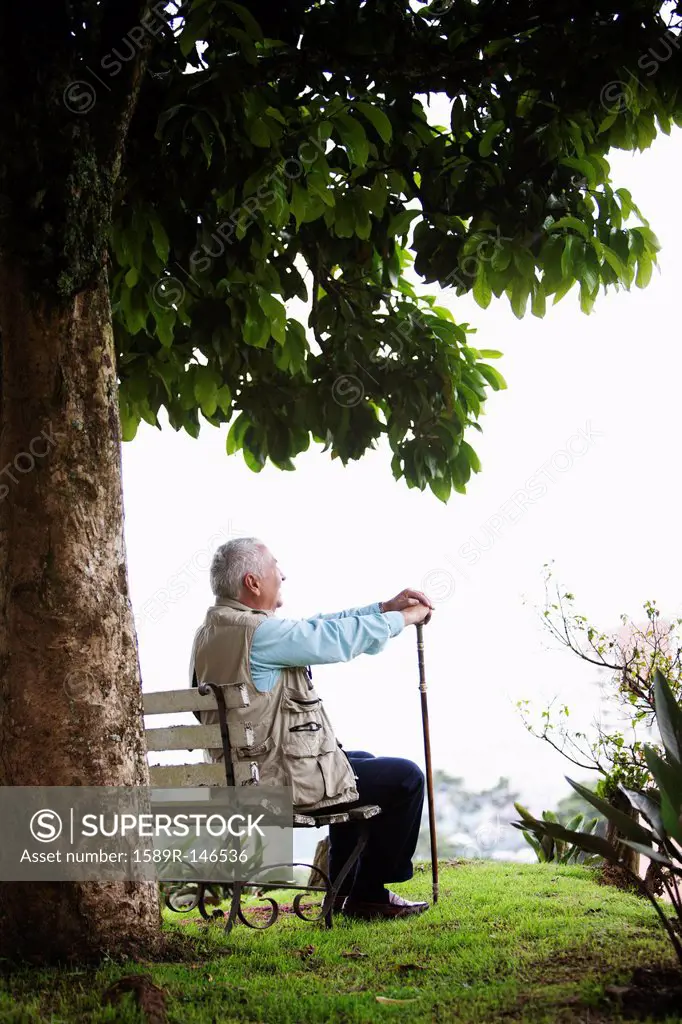 Senior man sitting on park bench