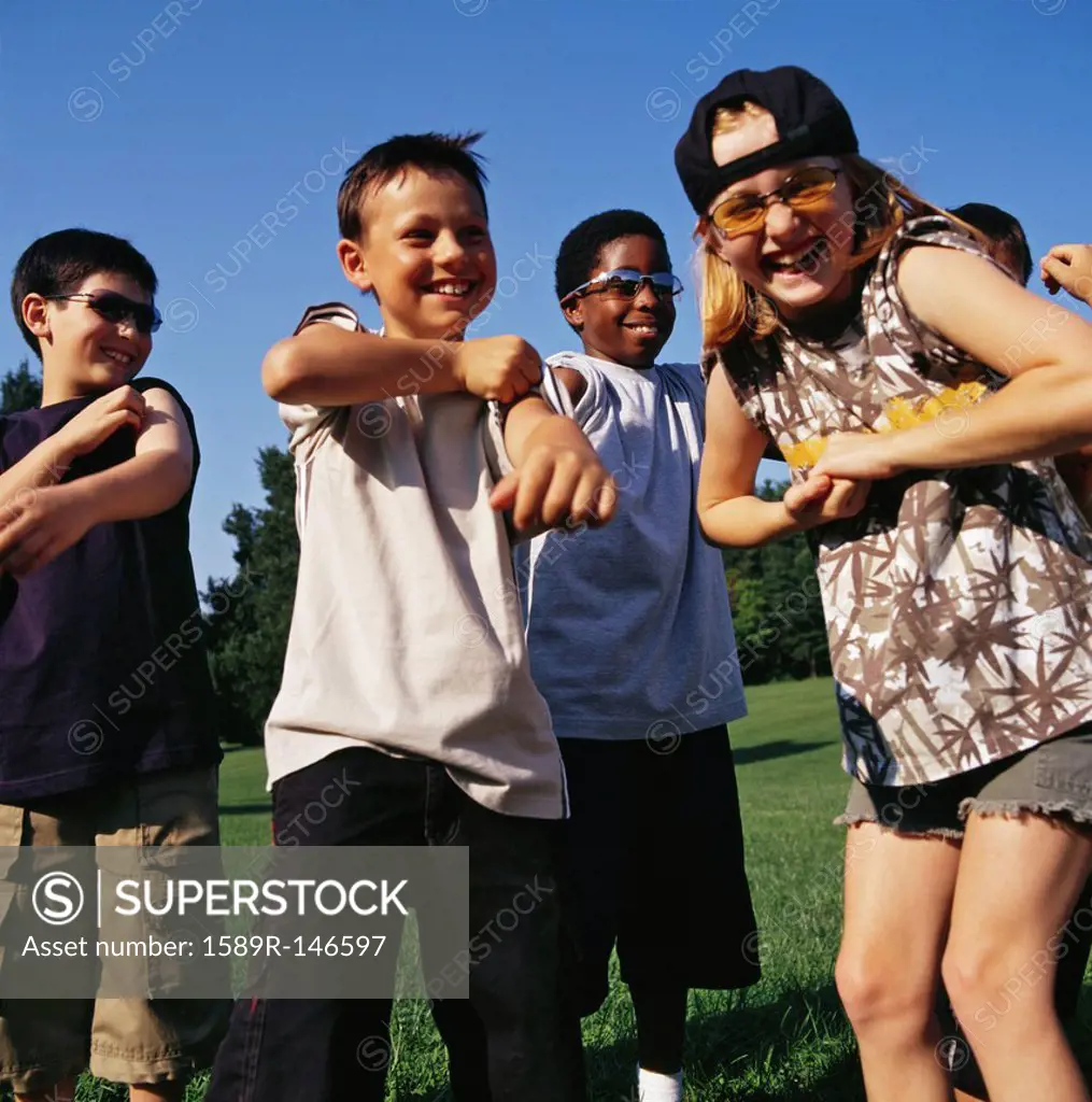 Laughing children playing outdoors together