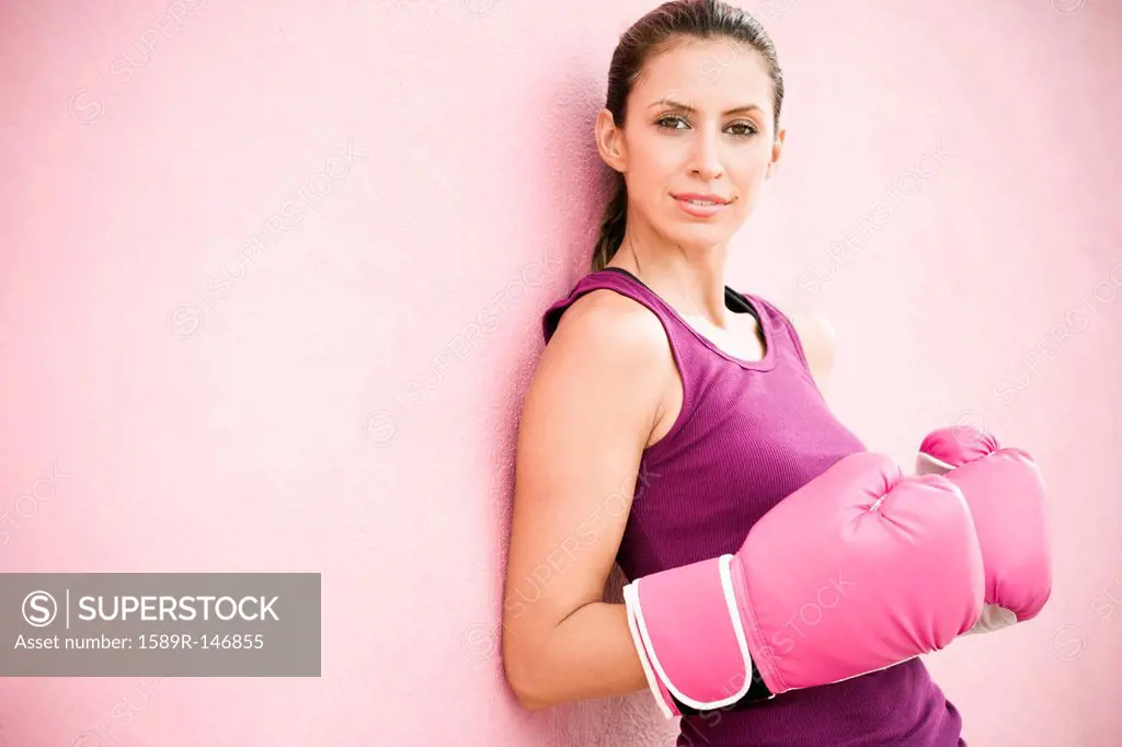 Hispanic woman in boxing gloves