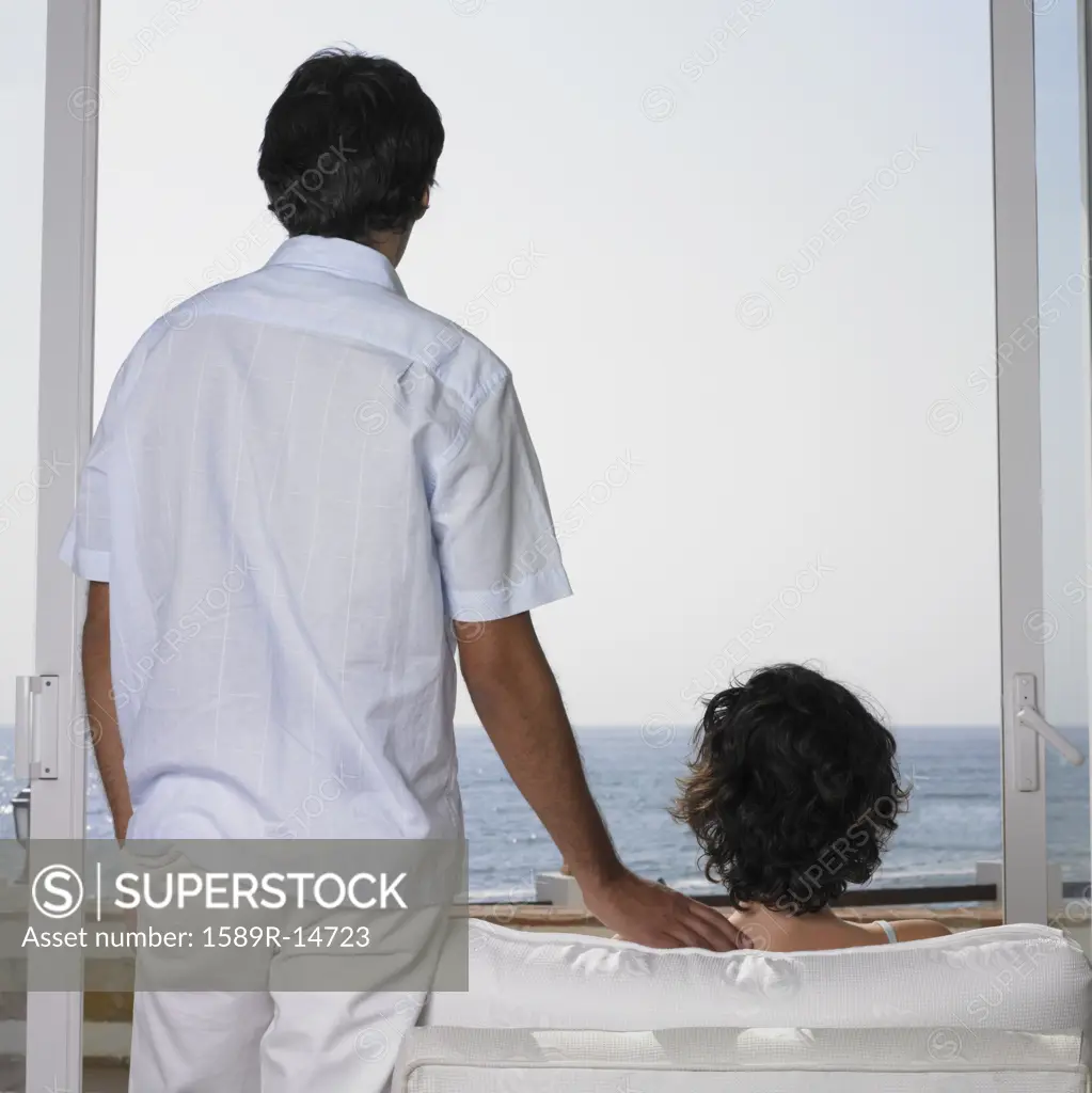 Young couple looking at ocean