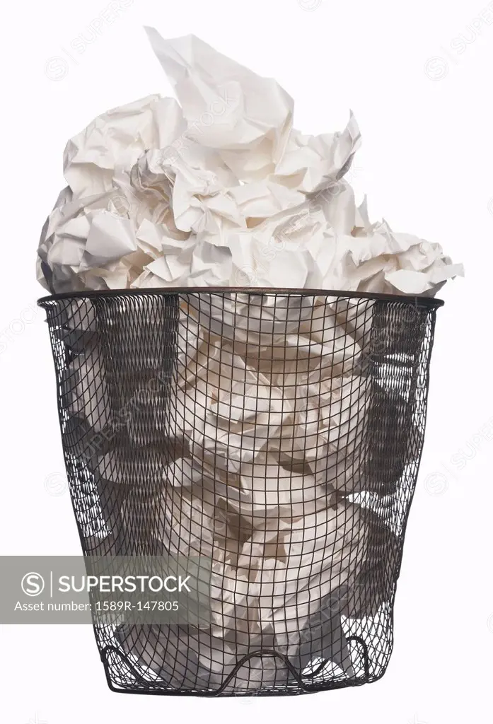 Wastepaper basket full of garbage