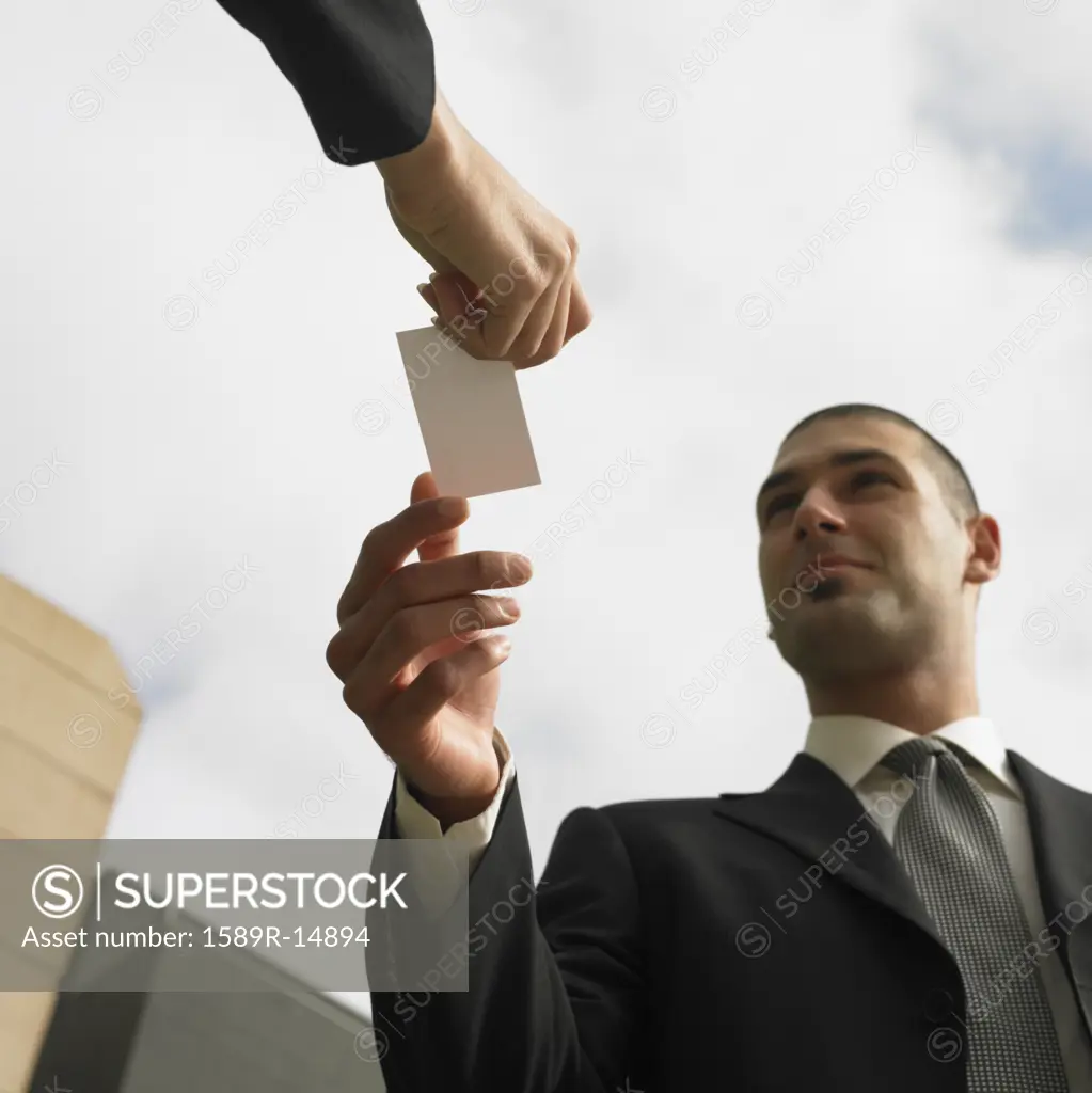 Businesspeople exchanging business cards