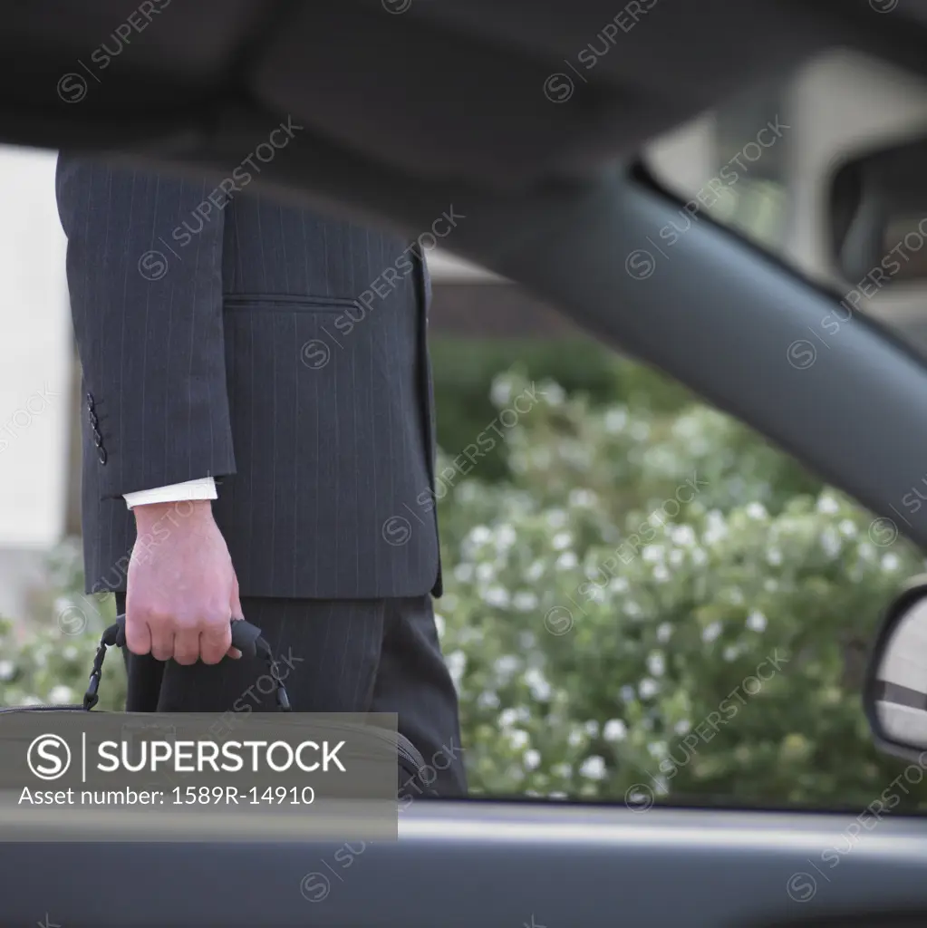 Businessman's side viewed from inside a car