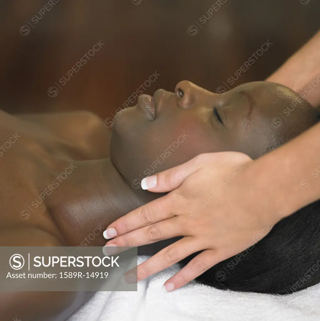 Young woman having a scalp massage