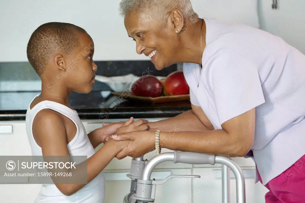 African American grandmother holding hands with grandson