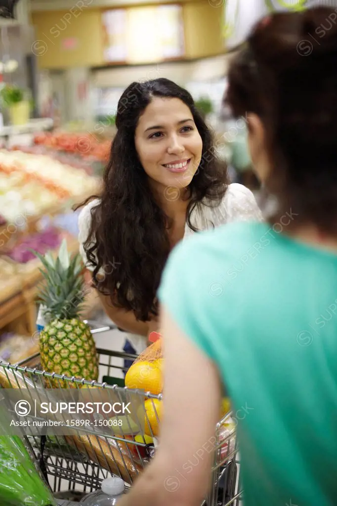 Women talking in grocery store
