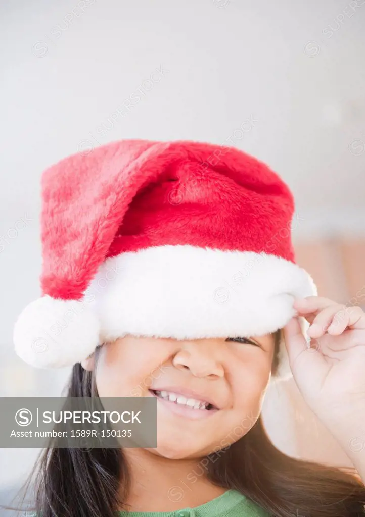 Korean girl wearing Santa hat