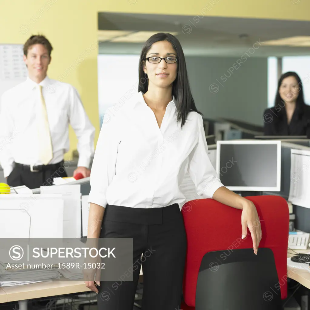 Man and women standing in office