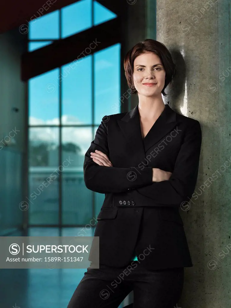 Caucasian businesswoman with arms crossed