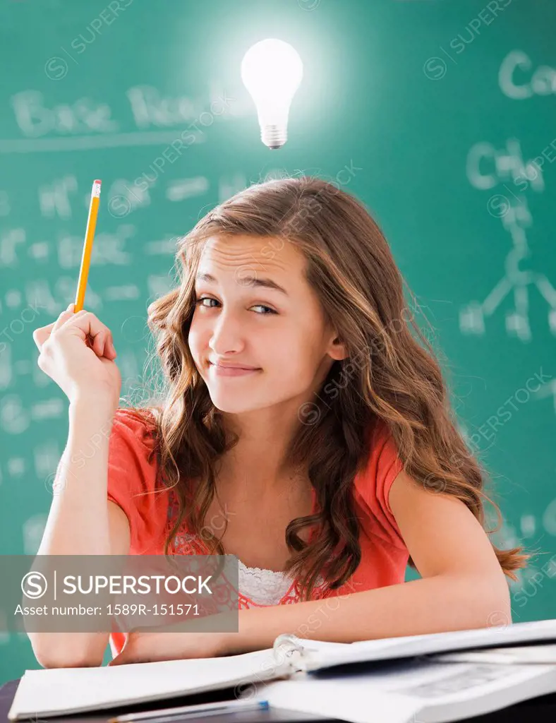 Caucasian student with light bulb over her head