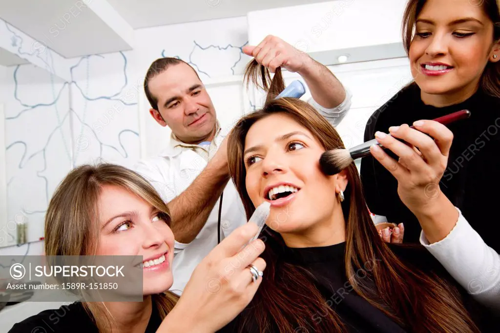 Hispanic woman having beauty treatments in salon