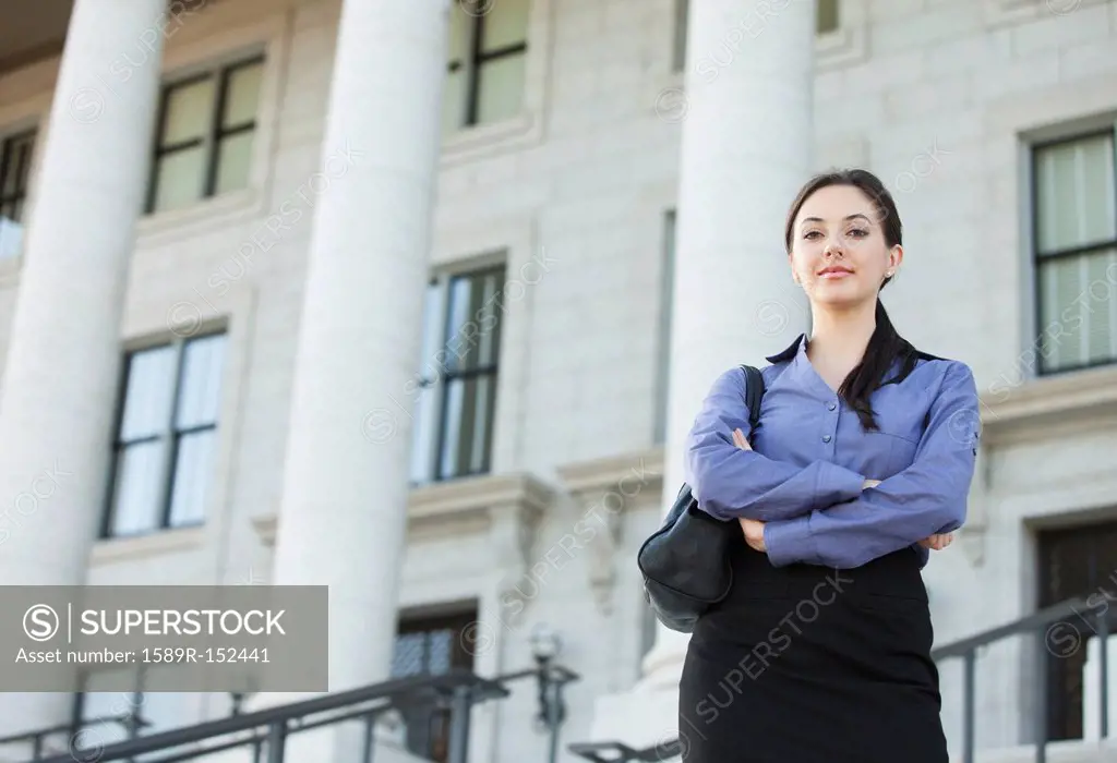 Caucasian businesswoman standing outdoors