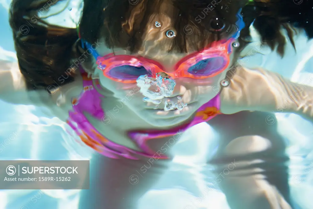 Girl underwater with goggles