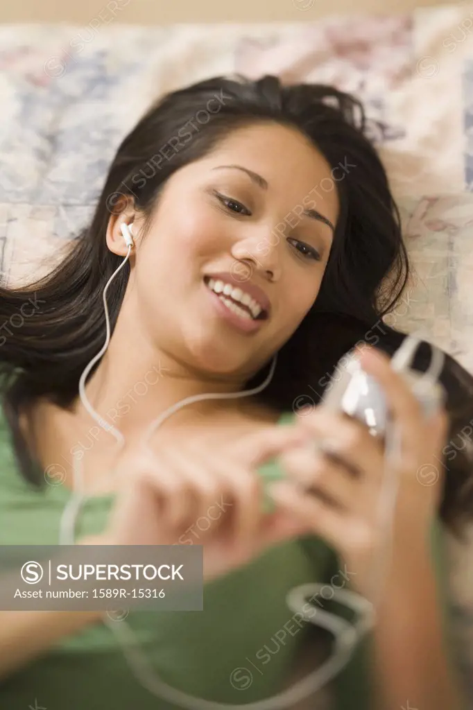 Woman listening to music on an mp3 player