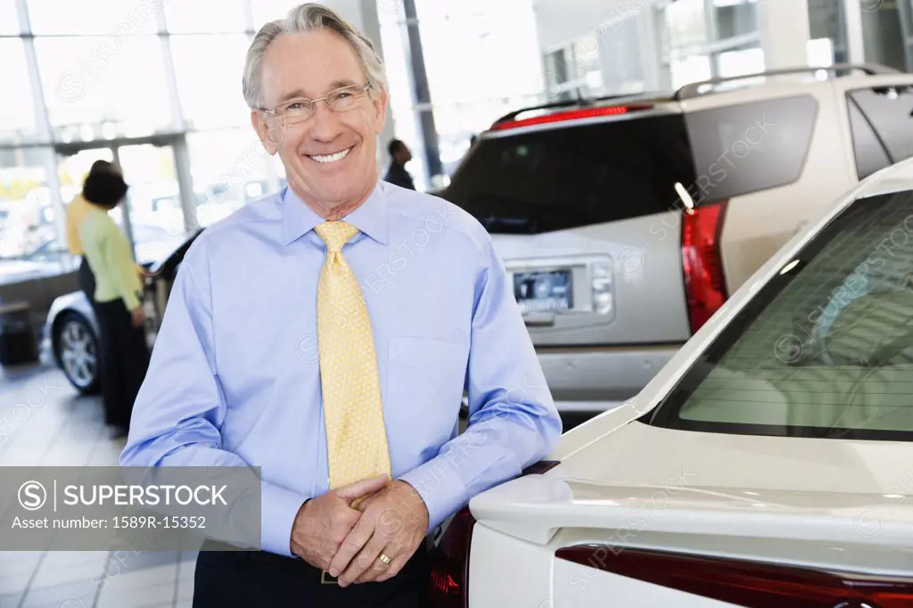 Car salesman smiling