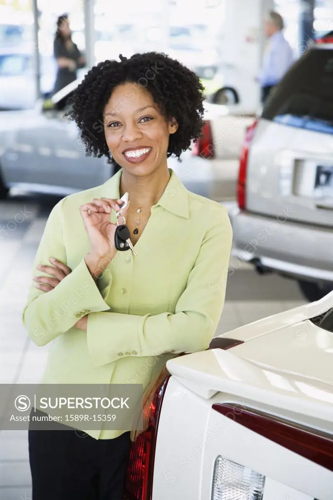 Car saleswoman smiling