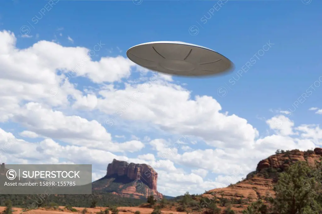 UFO flying over desert