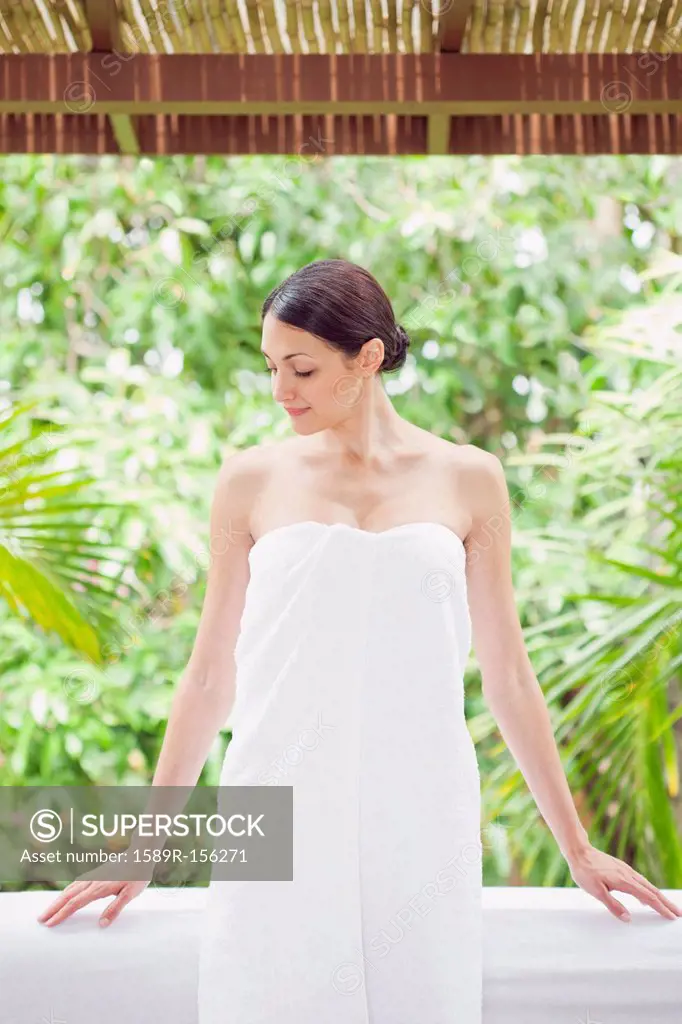 Caucasian woman in spa wrapped in a towel