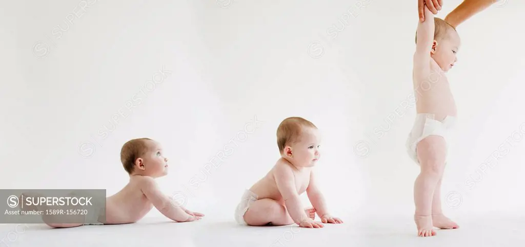 Babies laying, sitting and standing together