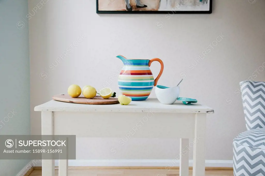 Pitcher, cutting board and lemons