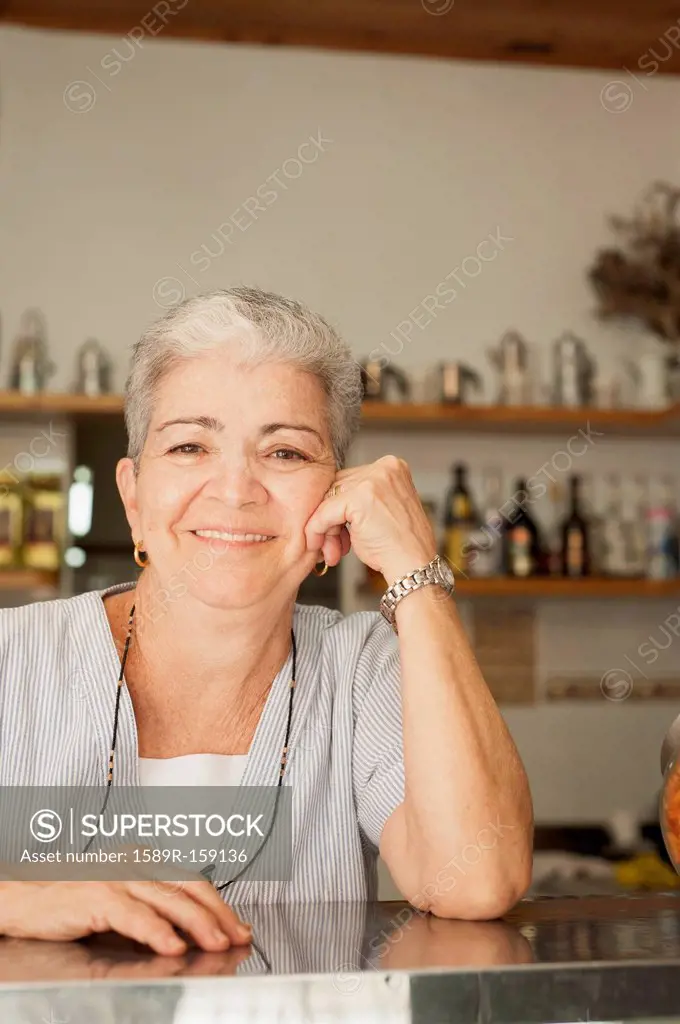 Smiling Hispanic woman in cafe