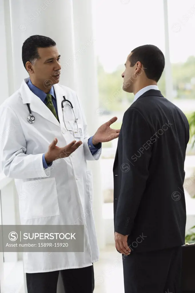 Doctor talking to a businessman