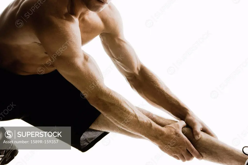 Caucasian man stretching before exercise