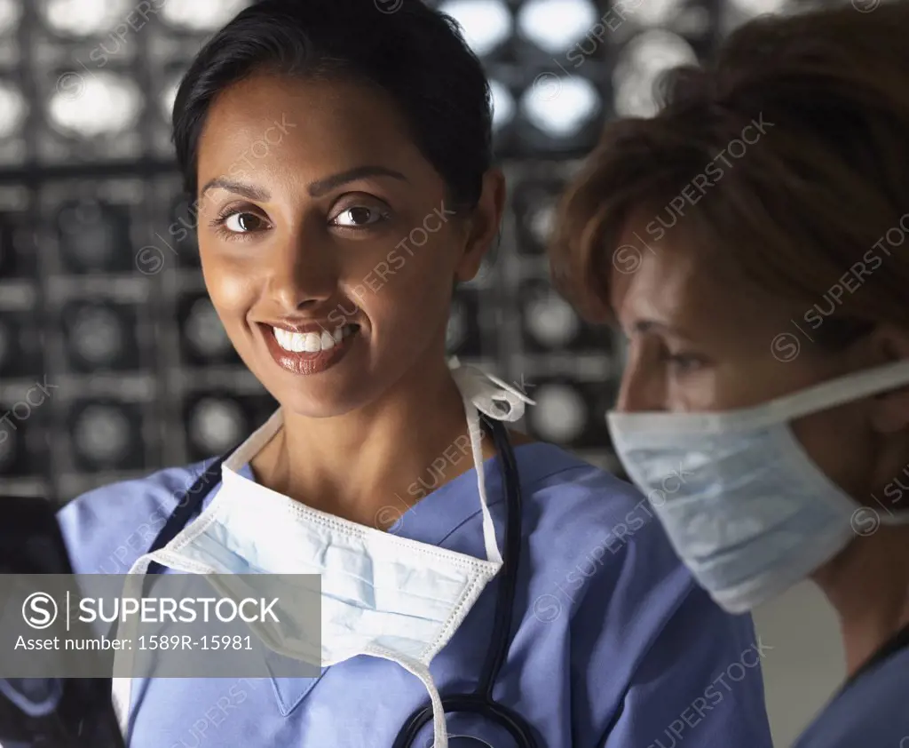 Portrait of two female doctors in scrubs