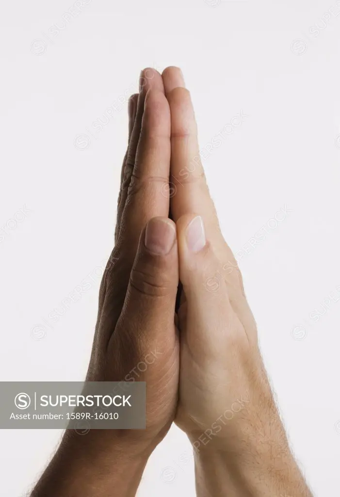 Close up of two hands in praying position