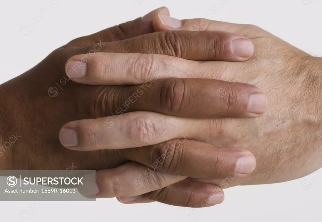 Close up of two hands interlocking