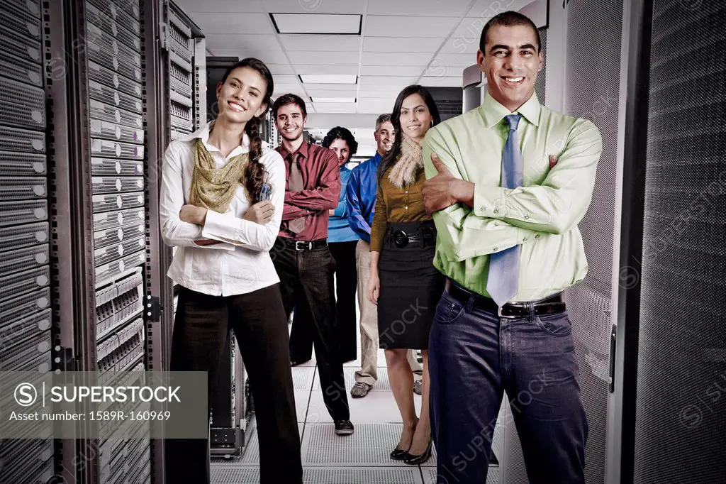 Business people standing together in server room
