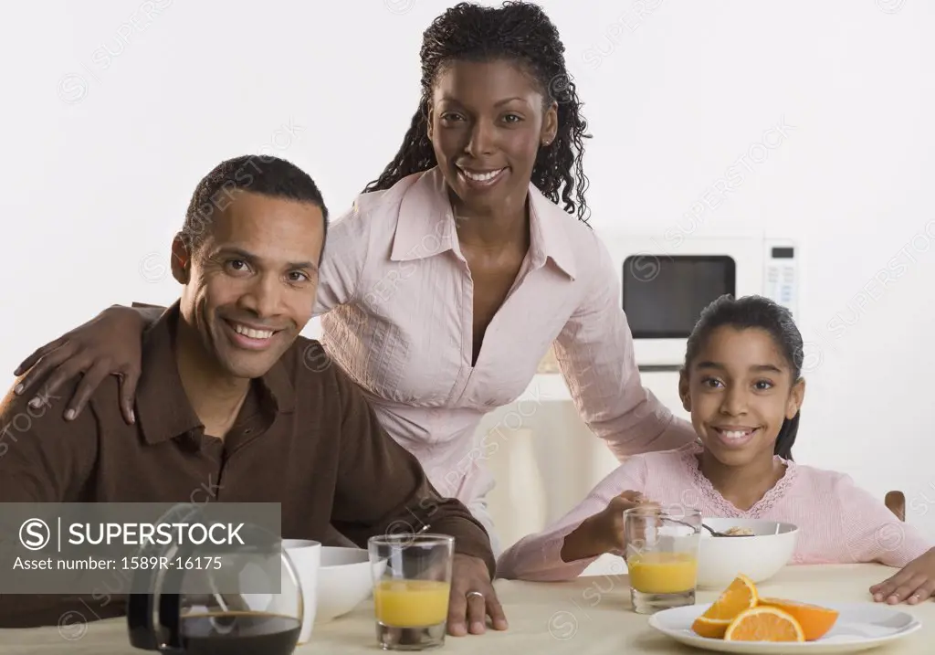 Portrait of family at breakfast table
