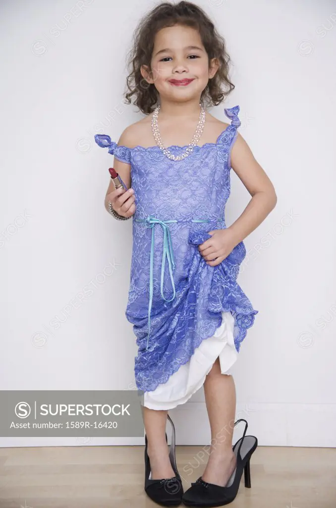 Portrait of girl playing dress up