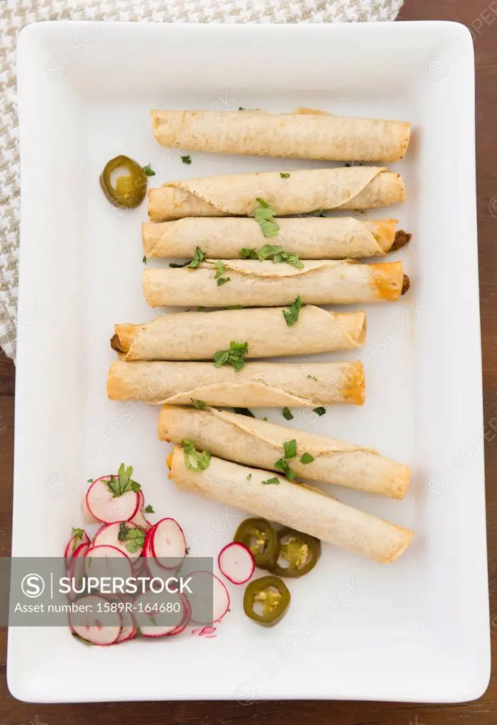Mexican taquitos on platter