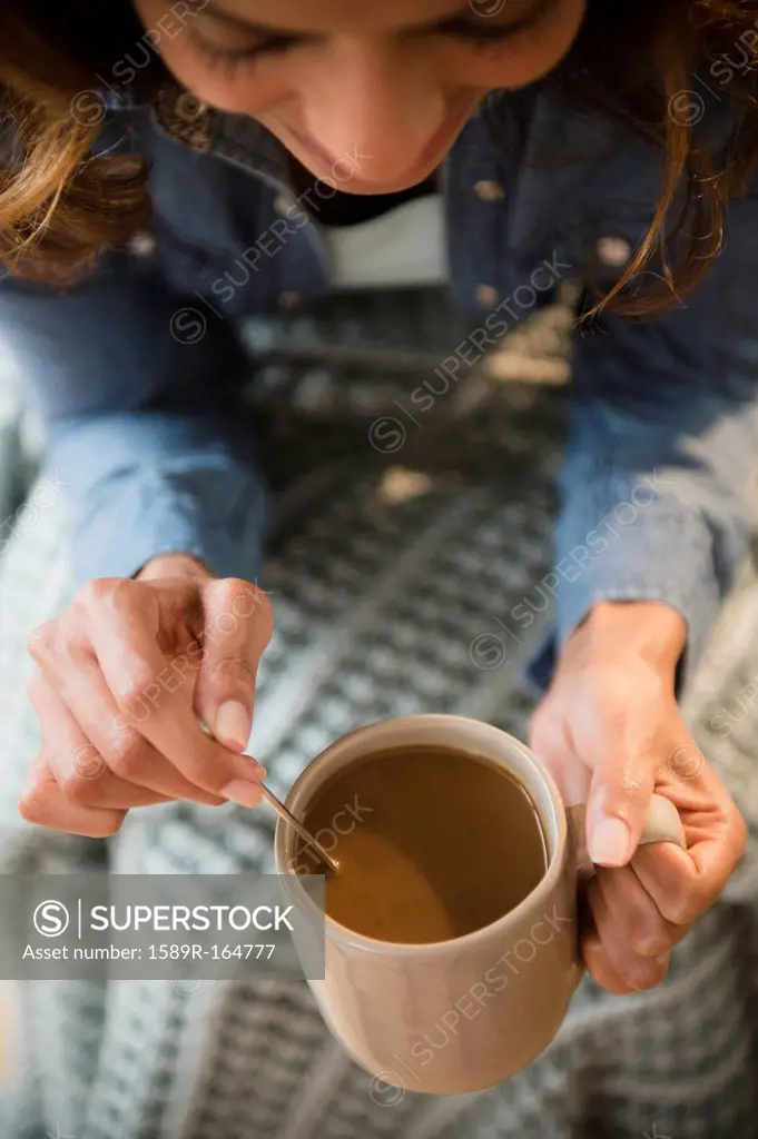 Cape Verdean woman drinking coffee
