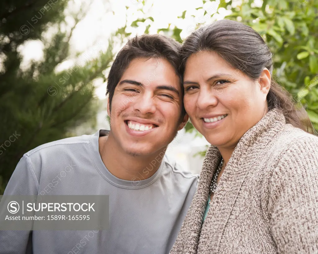 Smiling Hispanic mother and son