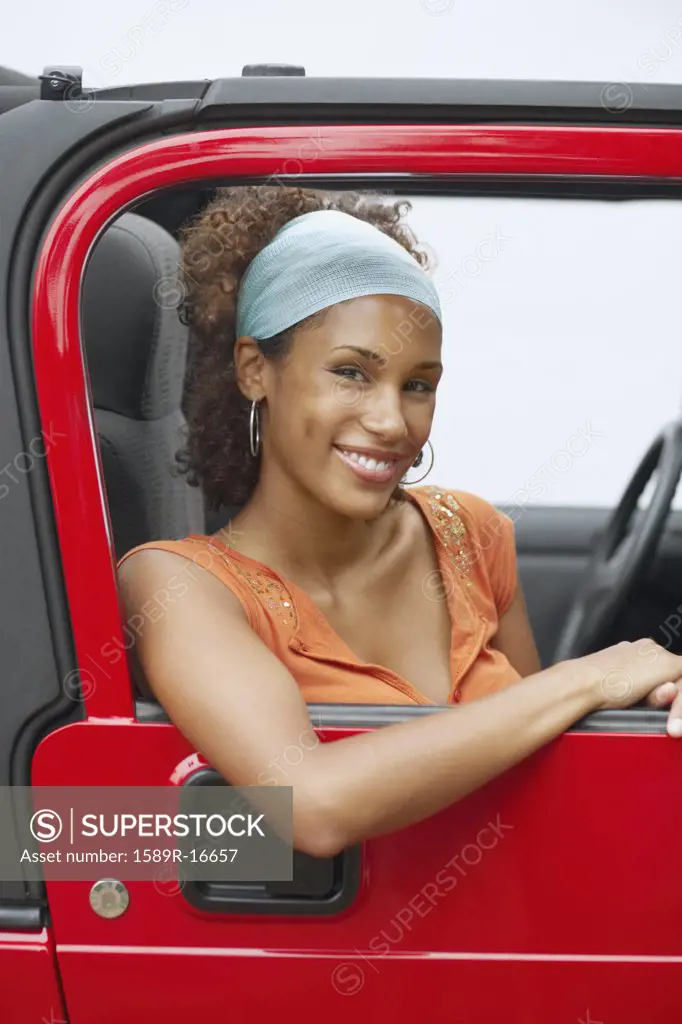 Young woman riding in a car