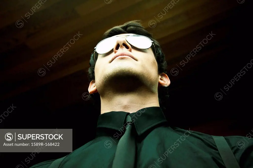 Serious mixed race man in sunglasses